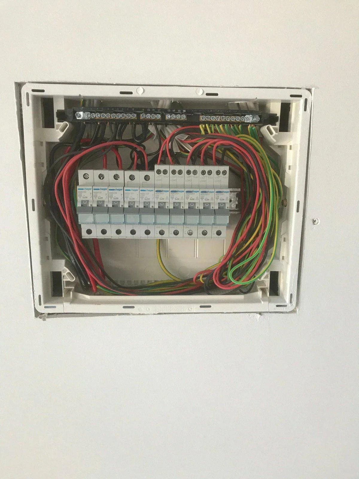 Newly wired switchboard with a full row of safety switches